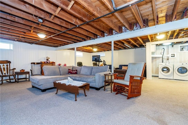 living area featuring carpet floors and washer and clothes dryer