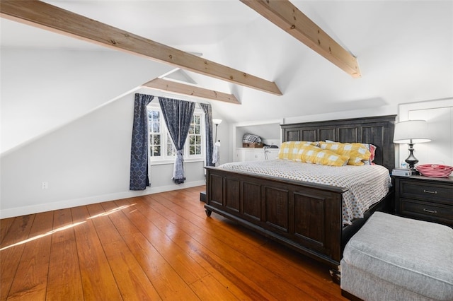 bedroom featuring baseboards and wood-type flooring