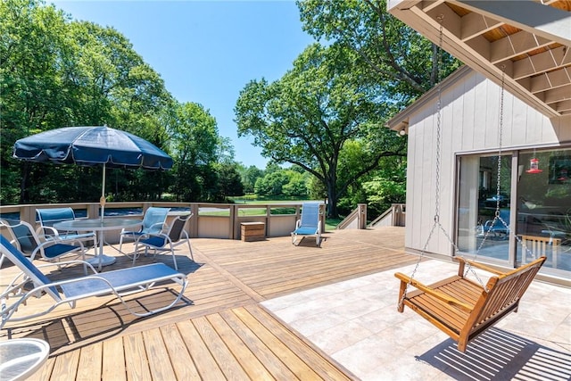 deck with outdoor dining area