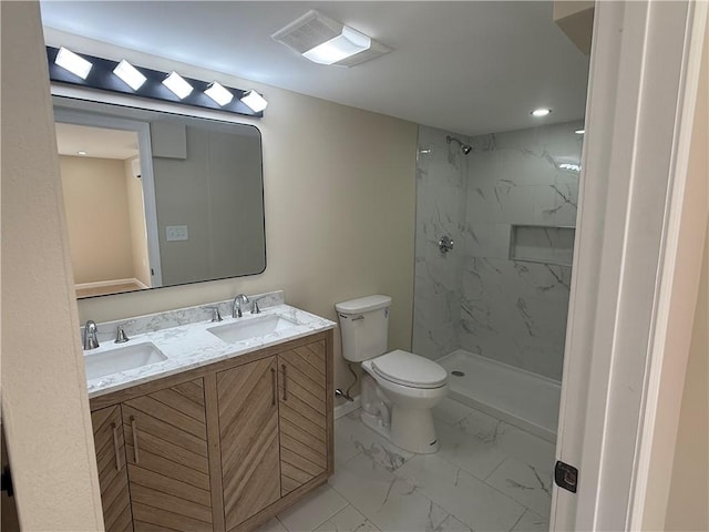 full bath with a sink, visible vents, toilet, and marble finish floor