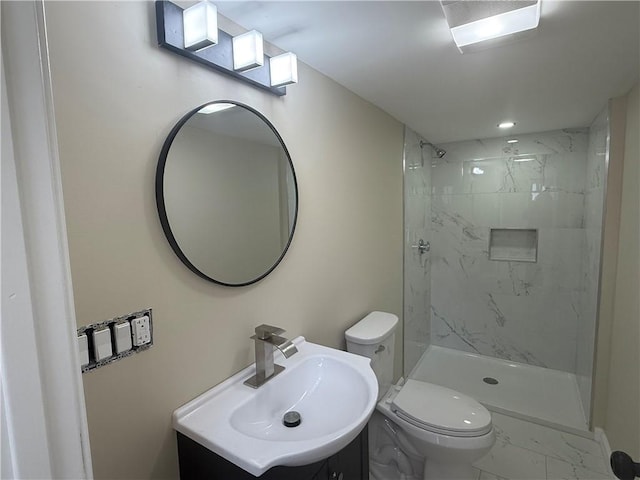 full bath with vanity, a shower stall, toilet, and marble finish floor