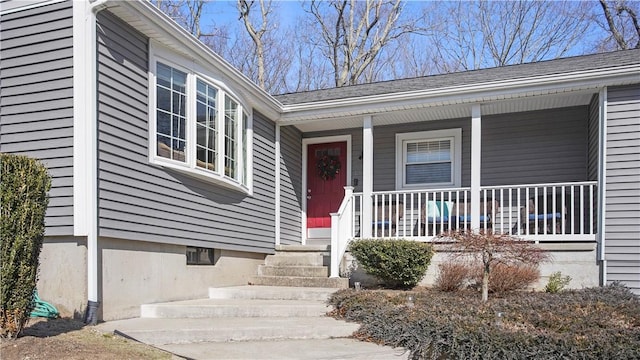 property entrance featuring a porch