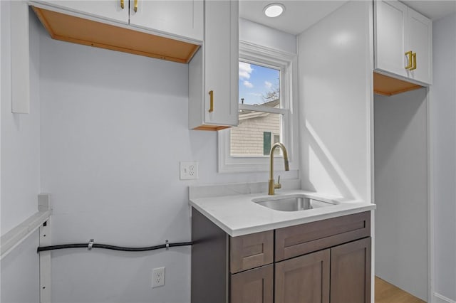 interior space with a sink and light countertops