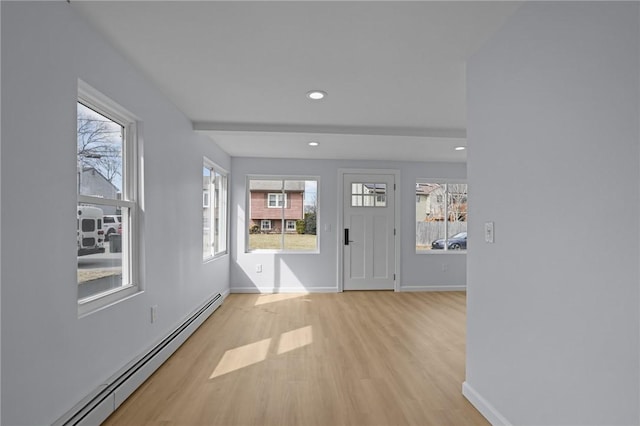 entryway with recessed lighting, a baseboard radiator, baseboards, and light wood-style floors