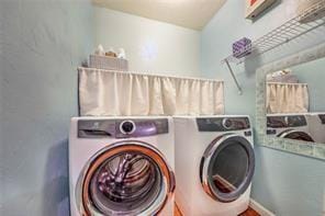 laundry room featuring laundry area and independent washer and dryer