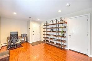 sitting room with recessed lighting and wood finished floors