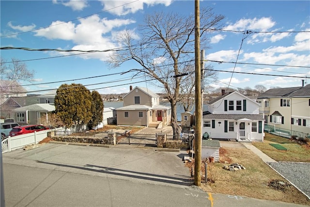 view of front of house featuring a fenced front yard and a residential view