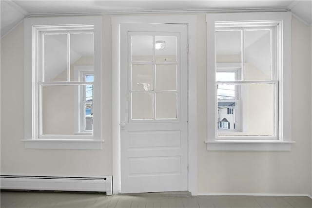 closet with a baseboard heating unit