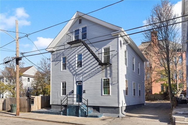 view of front of house featuring fence