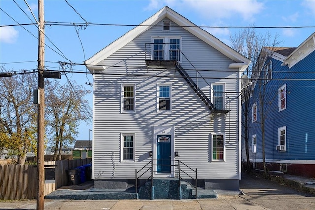 view of front of house featuring fence