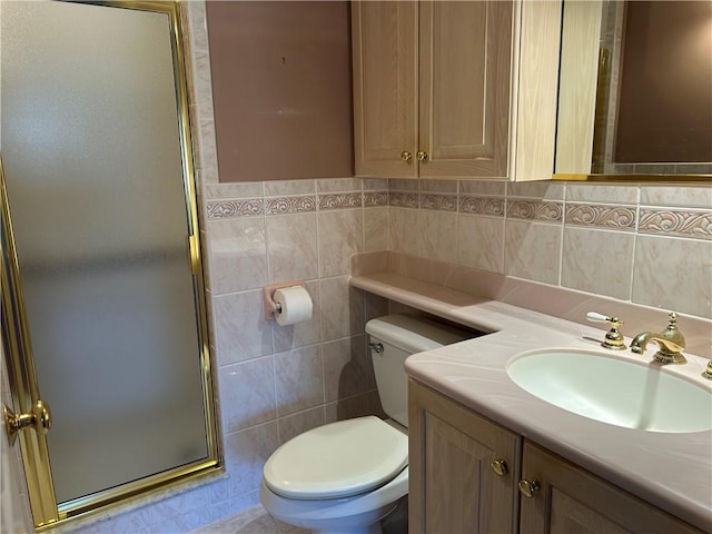 full bathroom featuring vanity, a shower stall, toilet, and tile walls