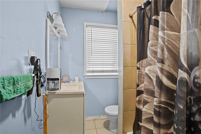 bathroom featuring tile patterned floors, a shower with curtain, toilet, and vanity