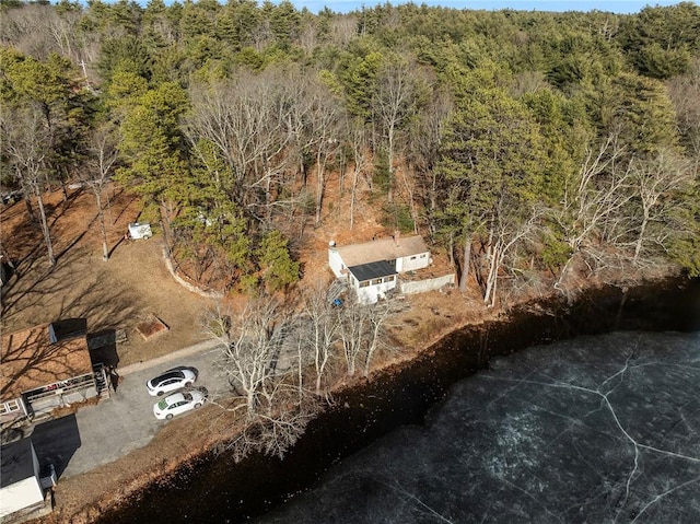 drone / aerial view featuring a view of trees