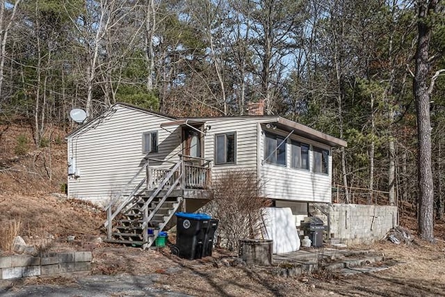 view of side of home with stairs