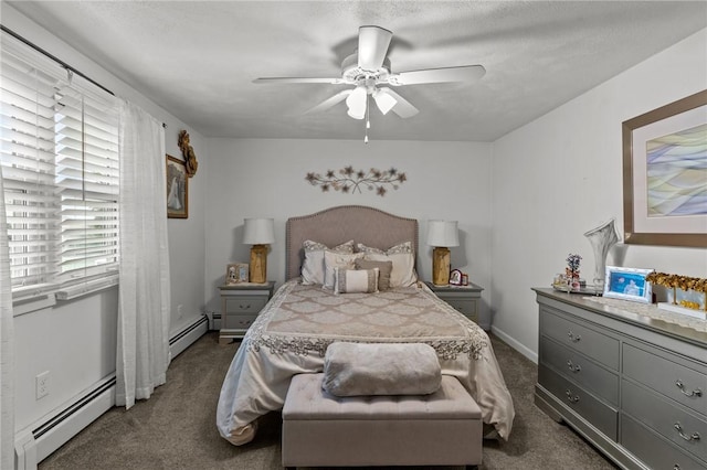 bedroom with dark carpet, a ceiling fan, a baseboard heating unit, and baseboards