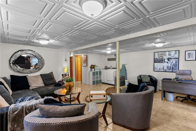 living area with washing machine and dryer and an ornate ceiling