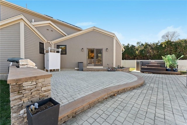 view of patio featuring fence