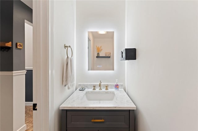 bathroom featuring vanity and baseboards