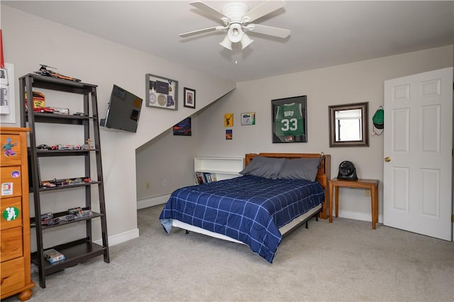 bedroom featuring a ceiling fan, carpet, baseboards, and a baseboard radiator