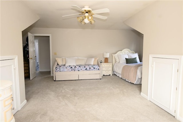 bedroom with light carpet and ceiling fan