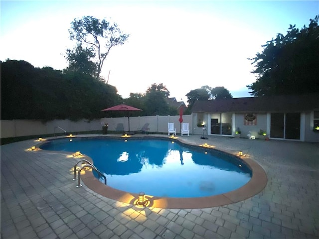 view of pool with a patio area, a fenced in pool, and a fenced backyard