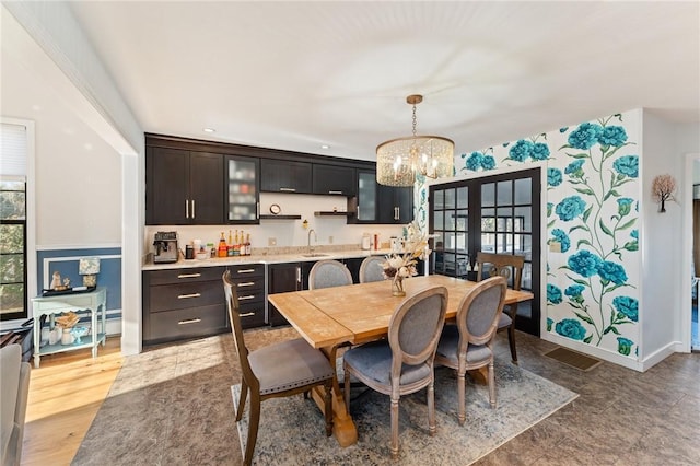 dining space with recessed lighting, baseboards, and a chandelier