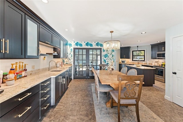 kitchen featuring a sink, stainless steel appliances, recessed lighting, and french doors