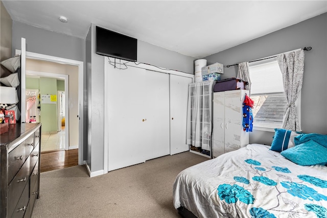 carpeted bedroom featuring a closet