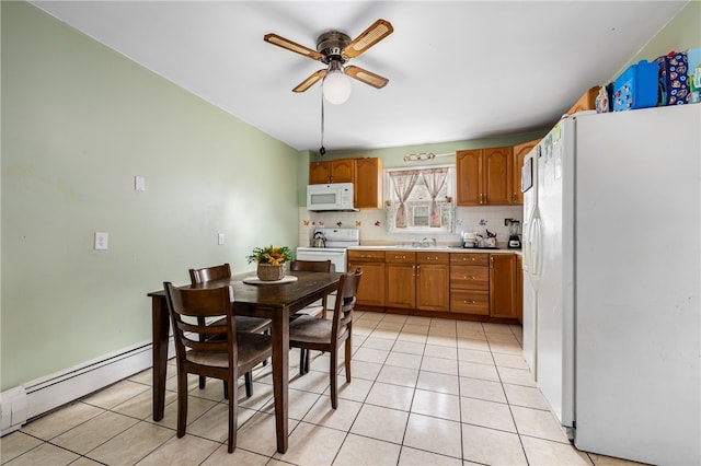 kitchen featuring white appliances, light tile patterned floors, a sink, a baseboard heating unit, and tasteful backsplash