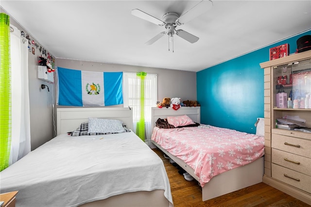 bedroom featuring a ceiling fan and wood finished floors