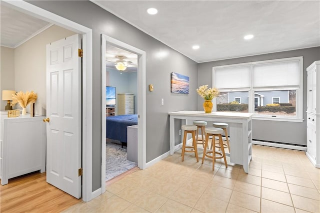 dining area with recessed lighting, baseboards, baseboard heating, and a ceiling fan