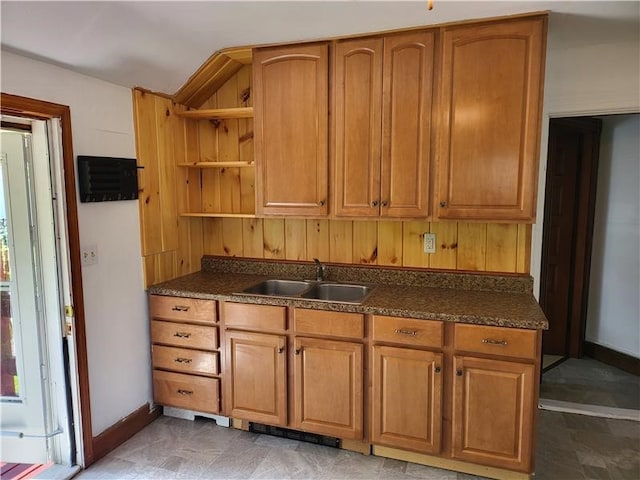 kitchen with a sink, visible vents, open shelves, and dark countertops