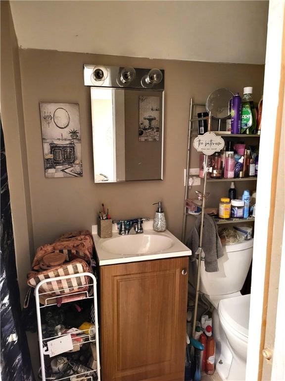 141 Centennial St, Burrillville, RI 02859 - half bathroom featuring vanity and toilet