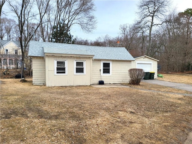 view of outbuilding with an outdoor structure and driveway