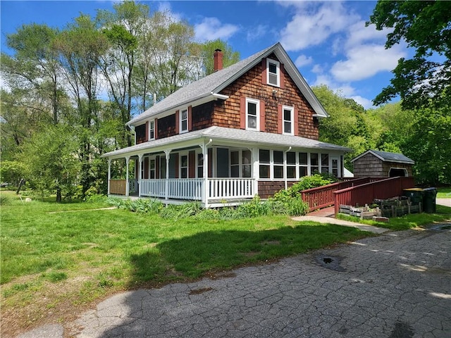 141 Centennial St, Burrillville, RI 02859 - back of property with a chimney, covered porch, a lawn, and a shingled roof