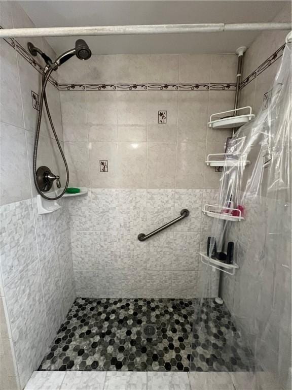 full bathroom with a shower stall