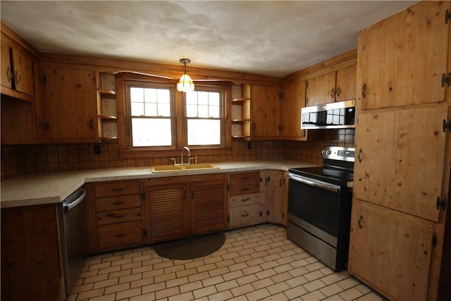 kitchen featuring a sink, open shelves, light countertops, and stainless steel appliances