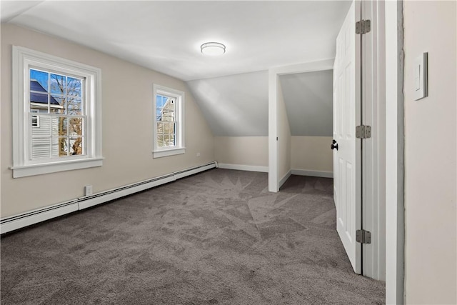 additional living space with vaulted ceiling, baseboards, carpet, and a baseboard radiator