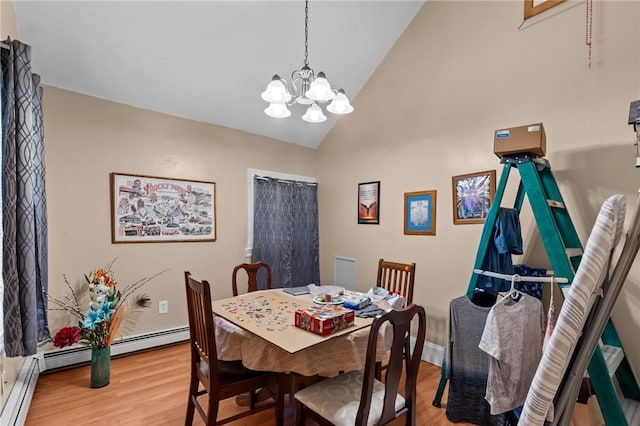 dining room with light wood finished floors, a notable chandelier, high vaulted ceiling, and a baseboard radiator