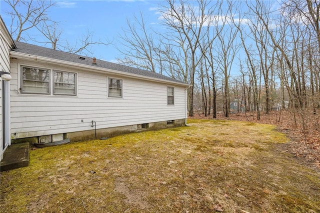 view of home's exterior with a yard