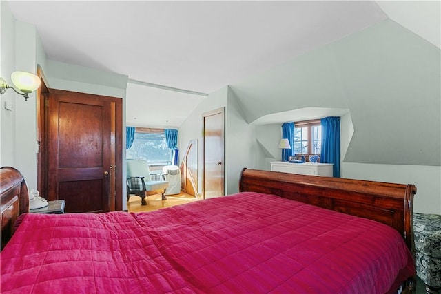 bedroom with lofted ceiling