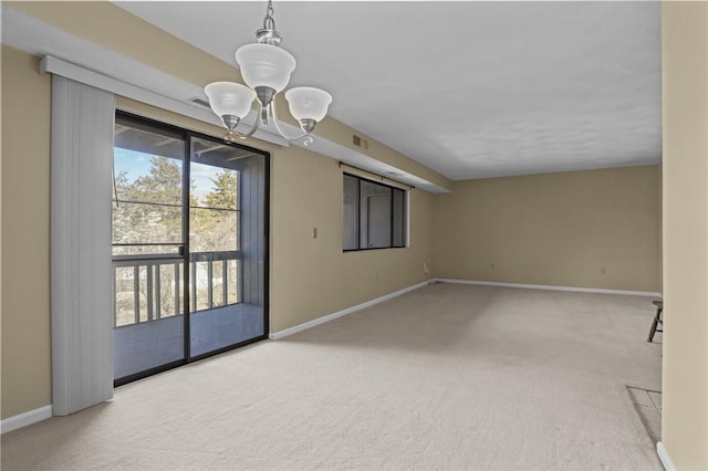 unfurnished room with visible vents, baseboards, and carpet floors