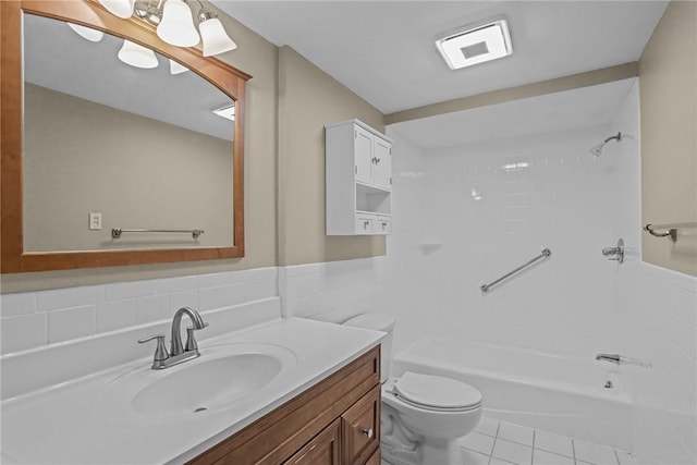 bathroom with tile patterned floors, visible vents, toilet, shower / tub combination, and vanity