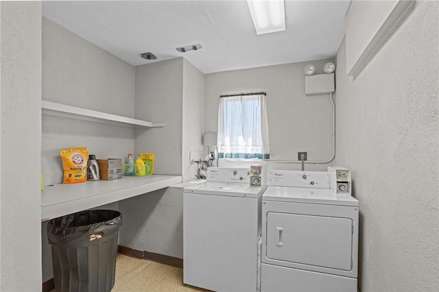 laundry room with laundry area and washing machine and clothes dryer