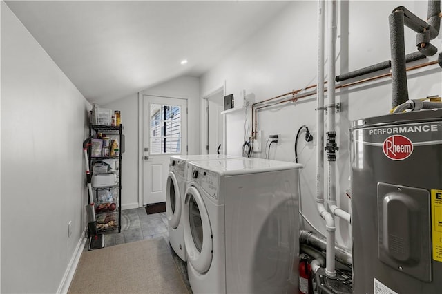 washroom featuring recessed lighting, washing machine and dryer, baseboards, and electric water heater