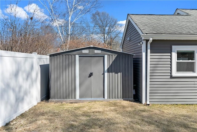 view of shed with fence