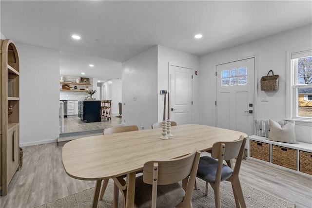 dining area with recessed lighting, baseboards, and light wood-style flooring