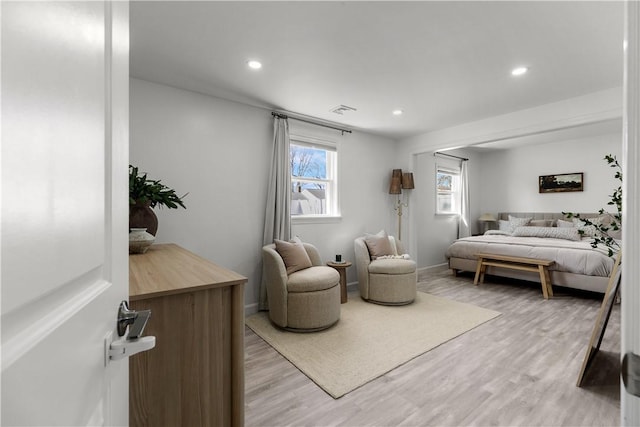 bedroom with recessed lighting, light wood-style floors, and visible vents