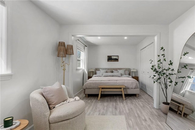 bedroom featuring recessed lighting, baseboards, and light wood-style flooring