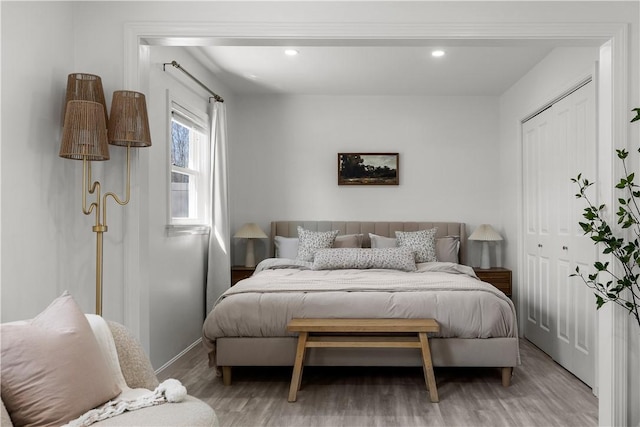 bedroom featuring recessed lighting, baseboards, and light wood finished floors